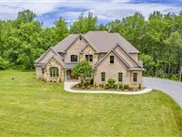 CUSTOM BRICK AND STONE ESTATE HOME ON 25 ACRES