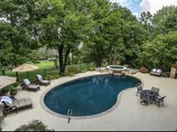 STUNNING HOME WITH LUXURIOUS DETAILS AND GORGEOUS POOL