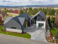 ELEGANT CONTEMPORARY HOME IN A COVETED GATED NEIGHBORHOOD