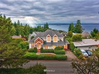 CUSTOM-BUILT HOME WITH SPECTACULAR SOUND AND MOUNTAIN VIEWS