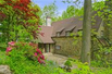 ELEGANT 1930'S MEDIEVEL REVIVAL HOME WITH BEAUTIFUL LANDSCAPED YARD
