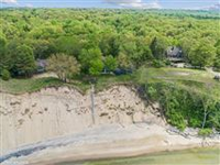 PRISTINE BEACHFRONT HOME WITH SWEEPING LAKE VIEWS