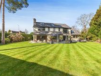 AN IMMACULATE COTSWOLD STONE BESPOKE DESIGNED RESIDENCE