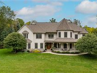 EXTRAORDINARY HOME ON PRIVATE WOODED ACRE