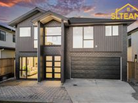 THIS MAGNIFICENT NEW HOME IS CAPTIVATING FROM THE MOMENT YOU STEP INSIDE