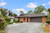 A CHARMING SINGLE LEVEL BRICK AND CEDAR HOME