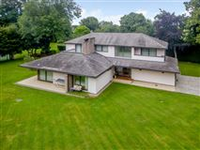 A UNIQUE CONTEMPORARY PROPERTY WITH A TENNIS COURT AND GENEROUS GROUNDS