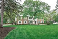 STUNNING COLONIAL ON PICTURESQUE AND PRIVATE LOT