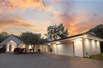 STUNNING CONTEMPORARY RANCH ON A PROMINENT LAKE