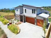 MAGNIFICENT AND PRIVATE LONG BAY HOME ON ELEVATED POSITION