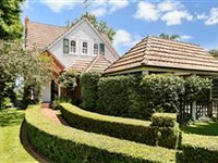 MUCH LOVED HOME IN EXCLUSIVE ENCLAVE