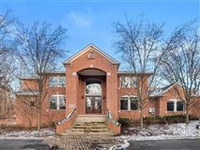 ALL BRICK COLONIAL ON A PRIVATE WOODED ACRE