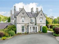 AN IMPRESSIVE COUNTRY HOUSE WITH IMAGINATIVE GARDENS AND WONDERFUL VIEWS