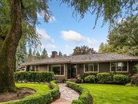 CHARMING ONE-LEVEL LIVING ON A MAJESTIC CORNER LOT