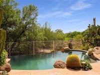ENJOY SUPERIOR OUTDOOR LIVING IN THIS CLASSIC BOULDERS HOME