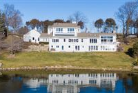 THIS SPECTACULAR UPDATED LAKE HOME HAS OVER 230 FEET OF PRISTINE FRONTAGE