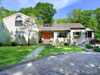 IMPRESSIVE COLONIAL ON A SECLUDED ACRE