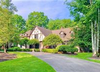 STUNNINGLY BEAUTIFUL GRAND TUDOR HOME ON QUIET STREET