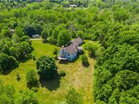 PICTURESQUE AND PRIME SETTING IN VICTOR ON 37 ACRES