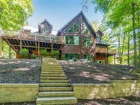 CONTEMPORARY RESORT HOME IN THE HILLS OF MOUNTAIN WOODS