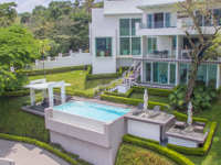 WONDROUS HOME SURROUNDED BY A GREEN GARDEN