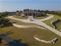 MAGNIFICENT HOME DESIGNED TO ENHANCE STUNNING HILL COUNTRY VIEWS FROM EVERY ROOM