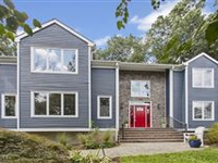 CUSTOM-BUILT CENTER HALL COLONIAL IN WONDERFUL LOCATION