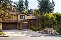 IMMACULATE CUSTOM HOME WITH BEAUTIFUL HILLSIDE VIEWS IN COWAN HEIGHTS