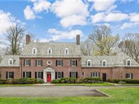 CUSTOM BRICK HOME ON LUSH PRIVATE ACRES