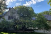 THREE-STORY STONE AND STUCCO HOME