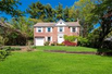 SADDLE ROCK ESTATES BRICK CENTER HALL COLONIAL