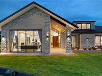 STRIKING DESIGNER HOME SET ON EXPANSIVE LOT