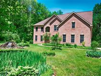 CUSTOM BRICK EXECUTIVE HOME ON OVER 68 ACRES