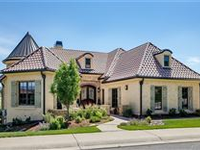 CUSTOM HOME IN THE SERENE HILLSIDE OF THE GATED RAVENNA GOLF COURSE