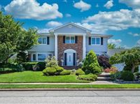EXPANSIVE GEORGIAN COLONIAL NESTLED ON AN OVERSIZED LOT