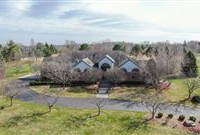 UNIQUE AND STYLISH HOME ON A WONDERFUL, PRIVATE THREE PLUS ACRES