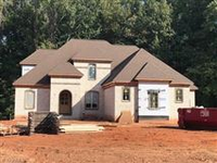 MAGNIFICENT CUSTOM HOME WITH TWO PRIMARY SUITES ON THE MAIN FLOOR