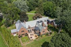 GRIMSWORTHY MANOR IS A MAGNIFICENT GATED ESTATE ON SECLUDED TWO PLUS ACRES