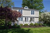 THIS MAGNIFICENT HOME OFFERS 95 FEET OF PRIVATE LEVEL LAKE FRONT