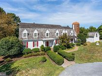 THIS WATERFRONT RETREAT FEATURES BREATHTAKING VIEWS FROM NEARLY EVERY ROOM