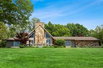 IMMACULATELY MAINTAINED HOME WITH 320 FEET OF LAKE MICHIGAN WATERFRONT VIEWS