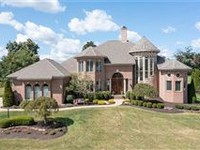 EXQUISITE BRICK HOME WITH CUSTOM DETAILS THROUGHOUT