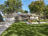 CHARMING LAKEFRONT HOME WITH UNMATCHED ENTERTAINING SPACES