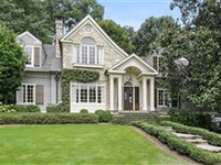 STUNNING HOME WITH BEAUTIFULLY LANDSCAPED YARD FEATURING GARDENS AND FOUNTAIN