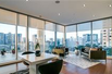 CONTEMPORARY HIGH-RISE HOME WITH BREATHTAKING CITY AND SUNSET VIEWS