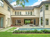 STUNNING CONTEMPORARY STONE AND STUCCO HOME WITH PRISTINE POOL AND SPA