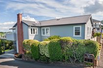 HOME ON A POPULAR TREE-LINED STREET