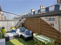 EXQUISITE TOP FLOOR APARTMENT OFFERS A MAGNIFICENT VIEW OF THE EIFFEL TOWER