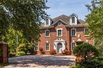 STATELY BRICK HOME OVERLOOKING LUSH GARDENS, GAZEBO, AND KOI POND