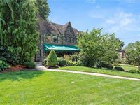 CHARMING TUDOR HOME WITH FOUR LEVELS OF LIVING SPACE